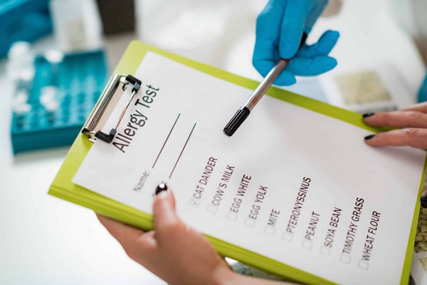 How can a UK-based bakery ensure compliance with allergen labeling laws?